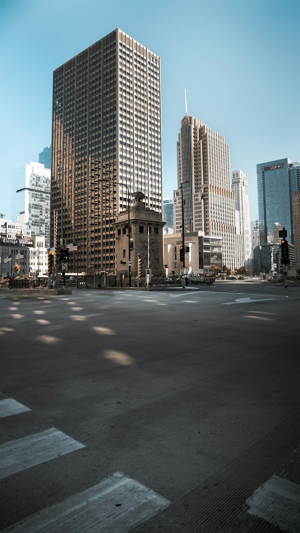 an empty parking lot in a city with tall buildings