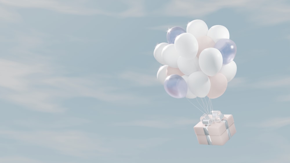 a bunch of balloons floating in the air