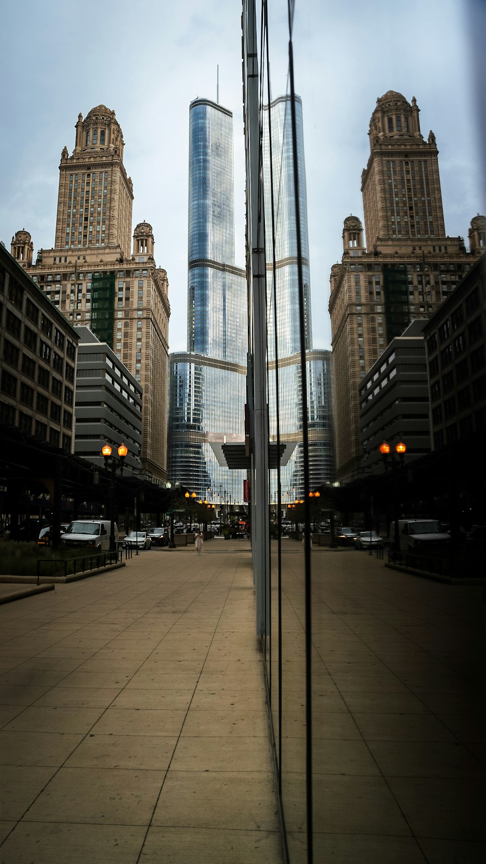 a tall building towering over a city filled with tall buildings