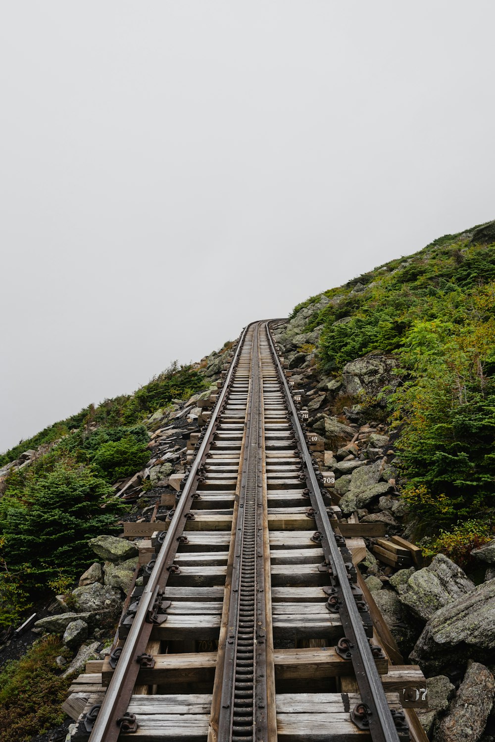 a train track going up the side of a mountain