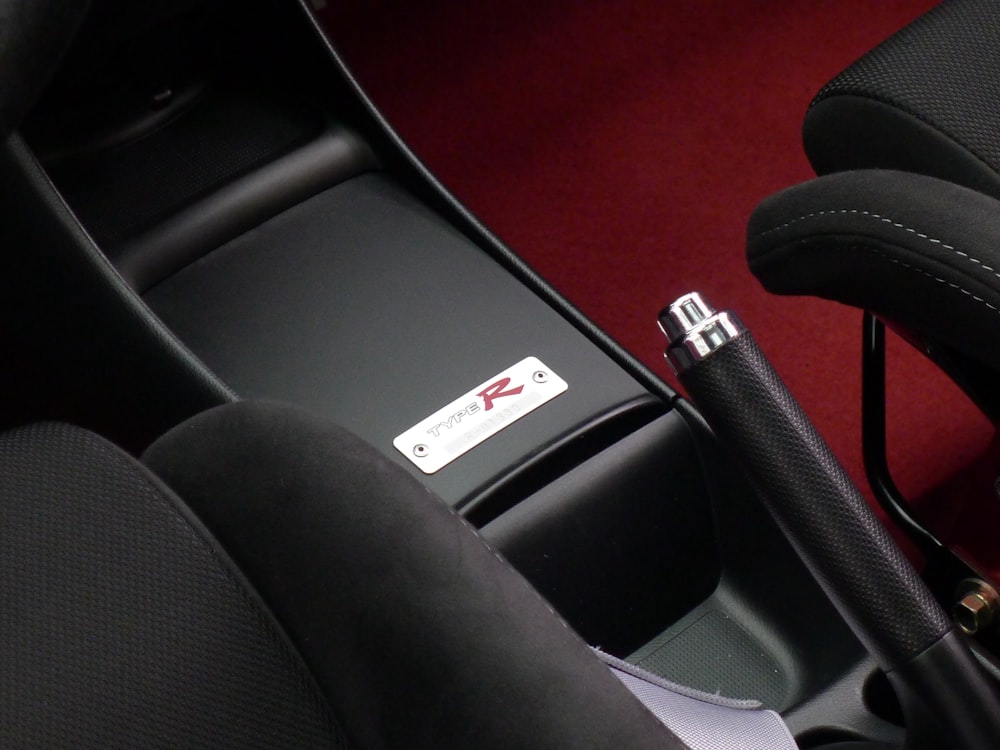 the interior of a car with a red carpet