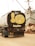 A truck with a tank displaying cartoon artwork on the back. The illustration features a large yellow face making a cheeky expression with one finger raised, situated against the backdrop of boats and industrial equipment.