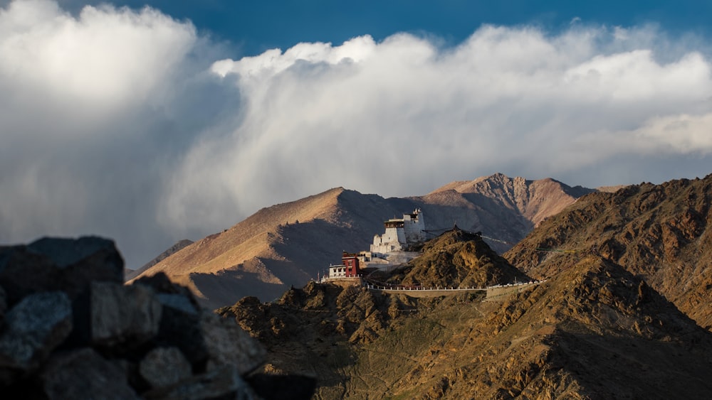 a large white building sitting on top of a mountain