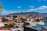 A vibrant photo of Guatapé's colorful buildings under a bright blue sky.
