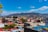 A vibrant photo of Guatapé's colorful buildings under a bright blue sky.