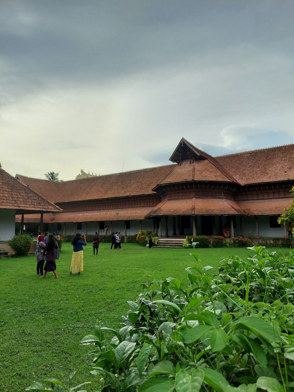 a group of people standing in front of a building