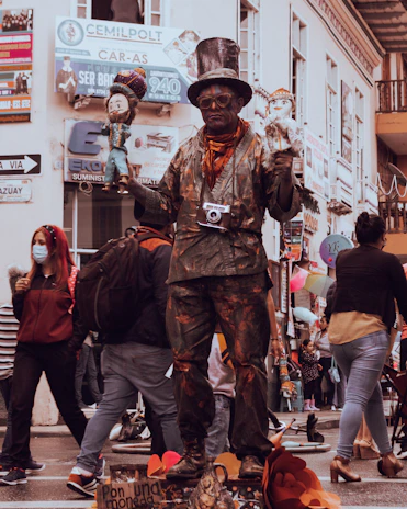 A candid photo of a street performer dressed as a detective, playfully searching for clues.