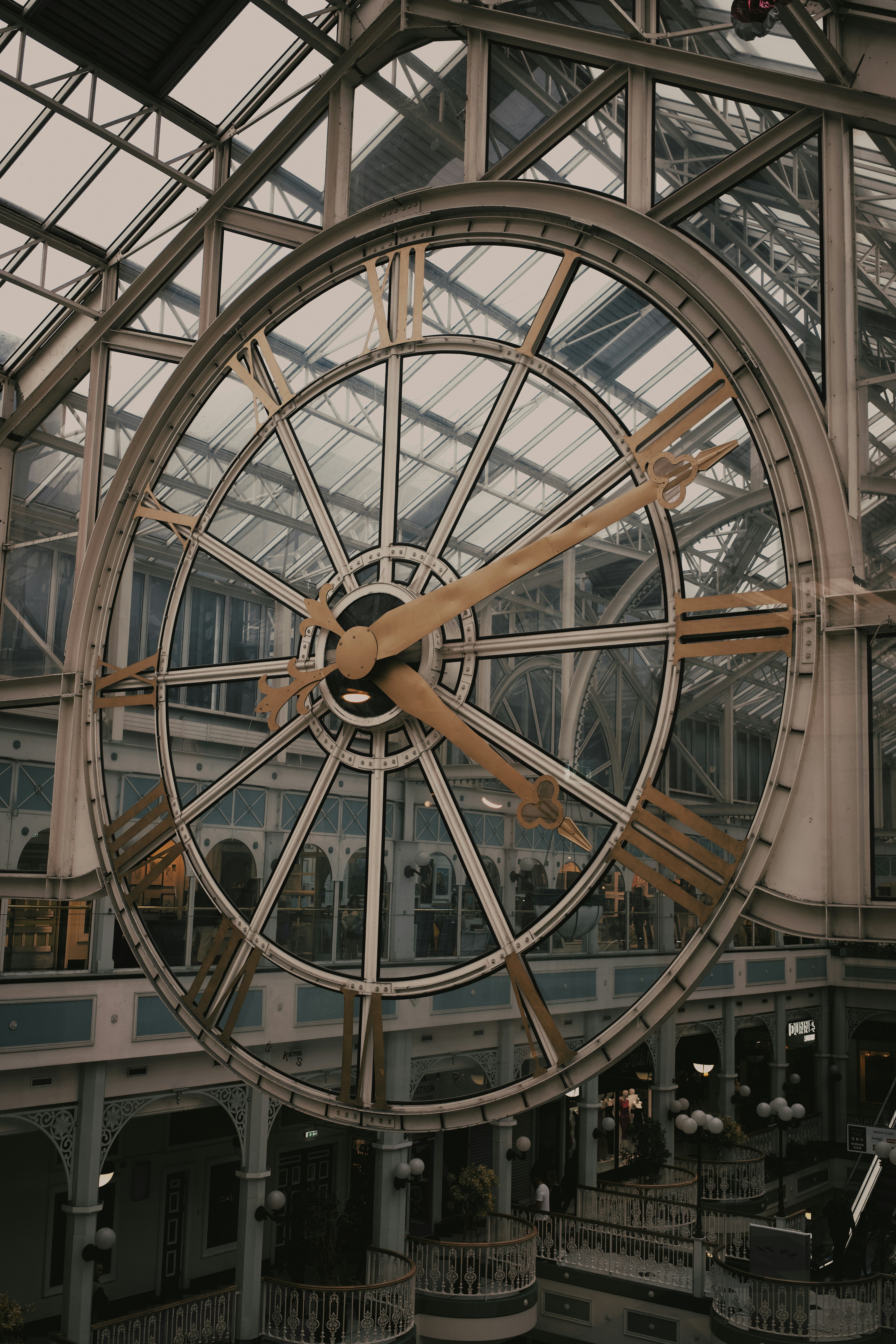 A large clock mounted to the side of a building photo – Free Building ...