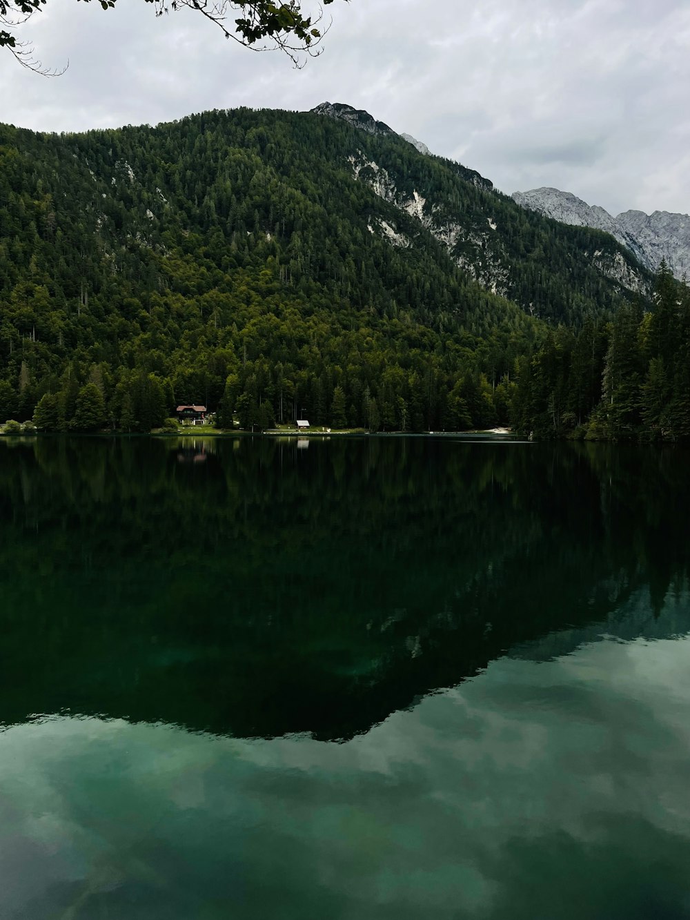 a body of water with a mountain in the background