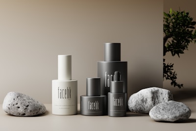 An artistic arrangement of skincare bottles against a minimalist background.