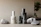 Close-up of eco-friendly skincare bottles nestled among green leaves