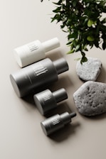 A serene arrangement of various supplement bottles on a neutral-toned background.