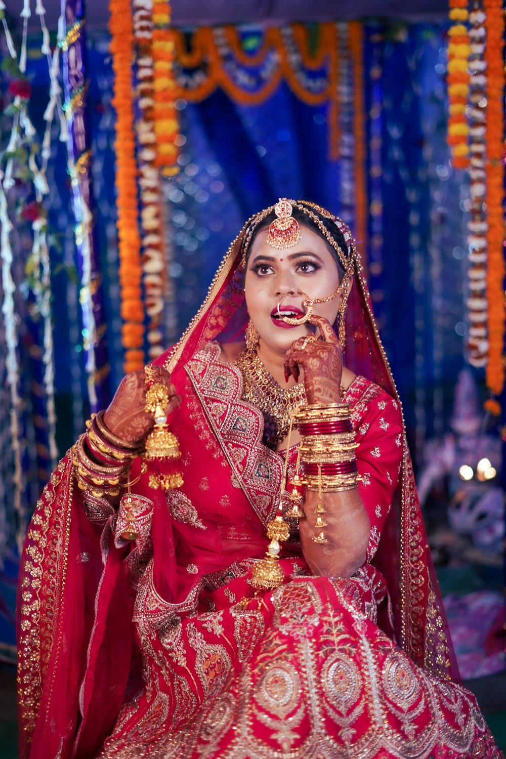 a woman dressed in a red and gold outfit