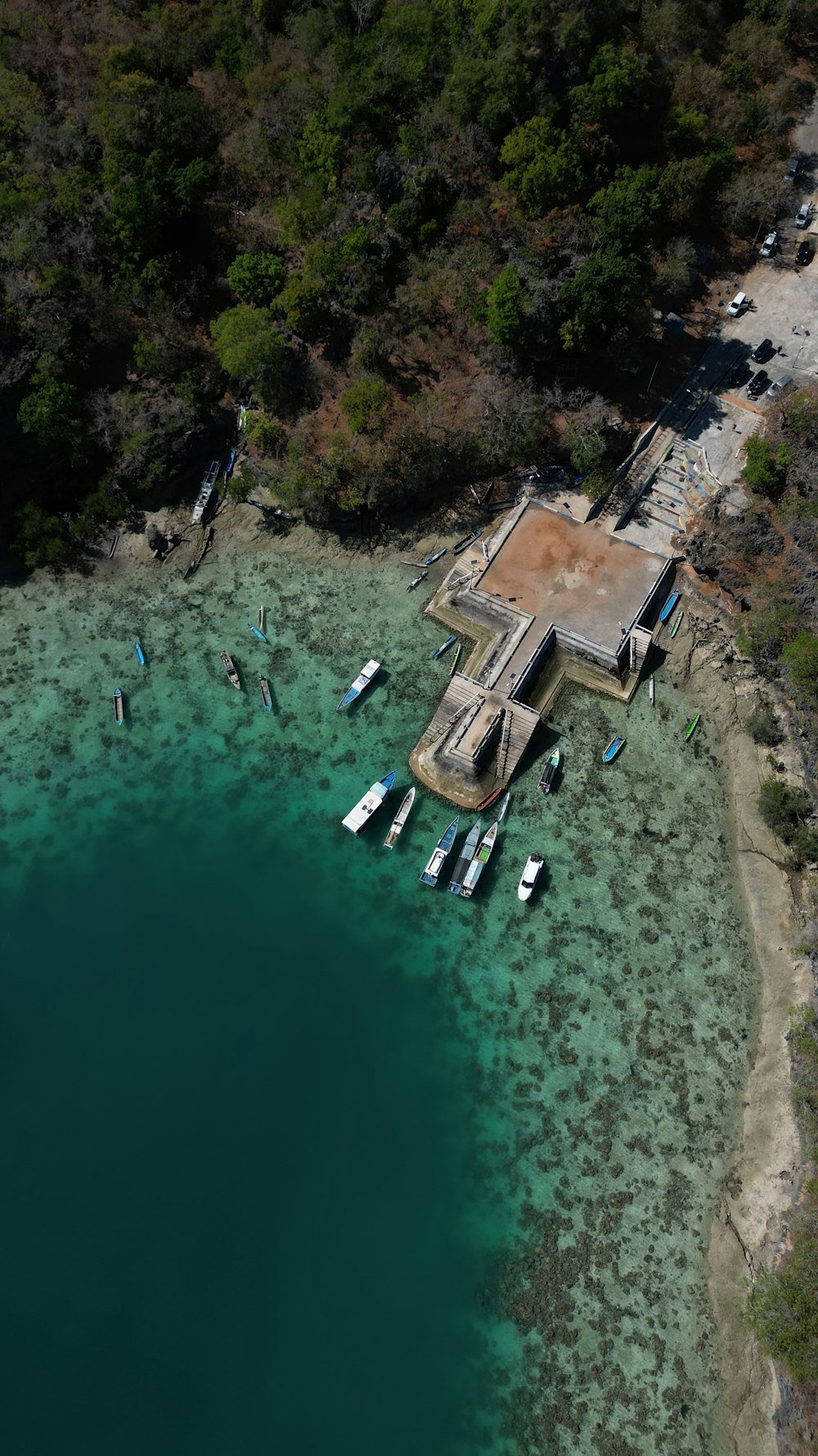 an aerial view of a boat dock with boats in the water