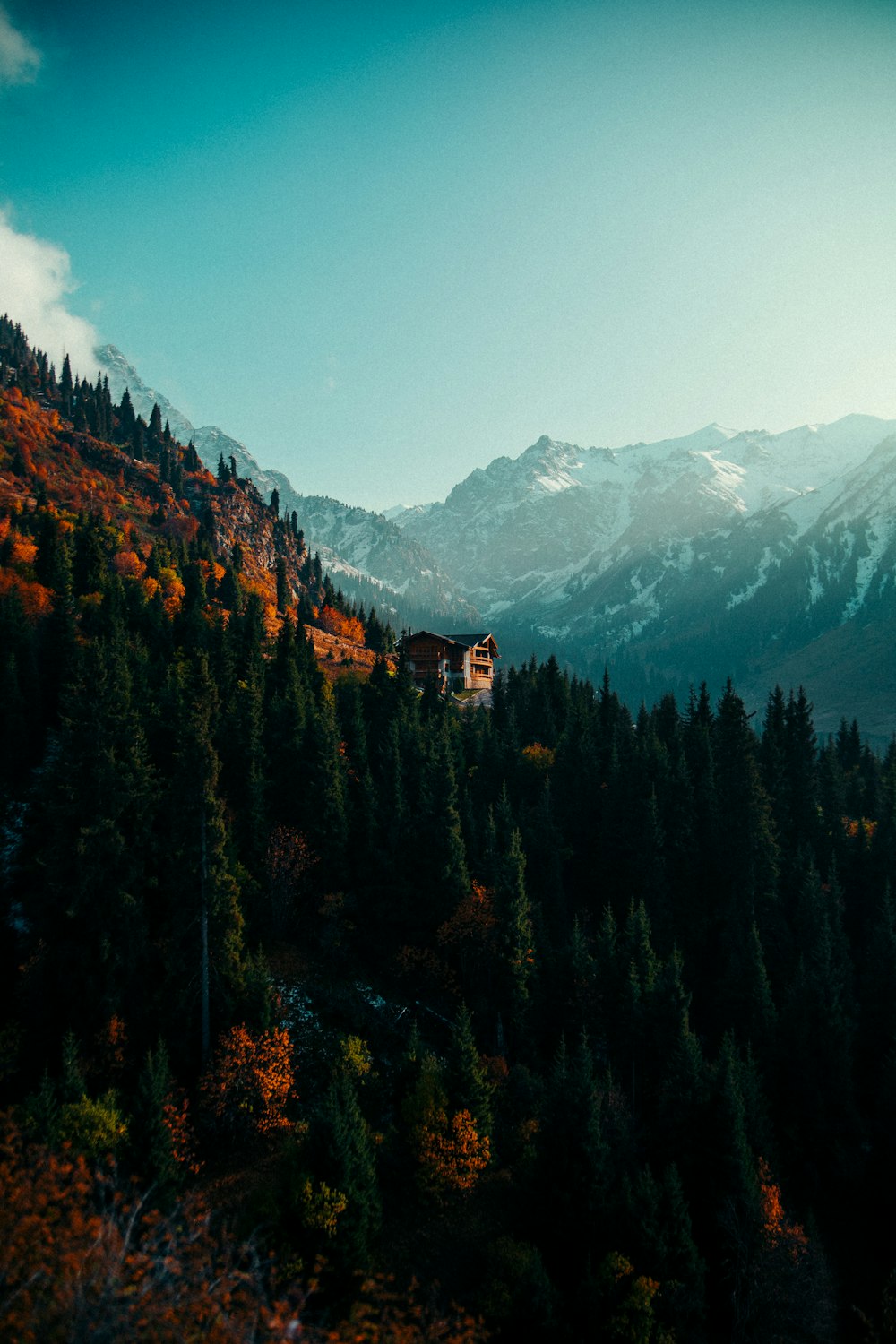 a mountain with a house on the top of it