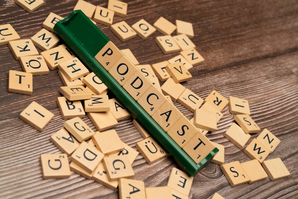 scrabble tiles spelling out words on a wooden table