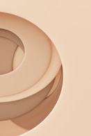 a close up of a circular object on a beige background