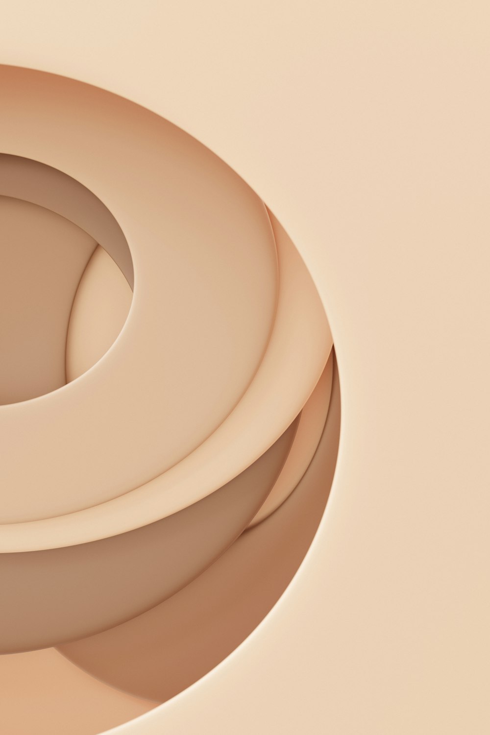 a close up of a circular object on a beige background