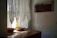 A serene living room bathed in soft pastel light with subtle mandala wall art.