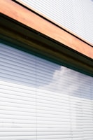 Close-up of a freshly installed modern window with sun protection blinds.