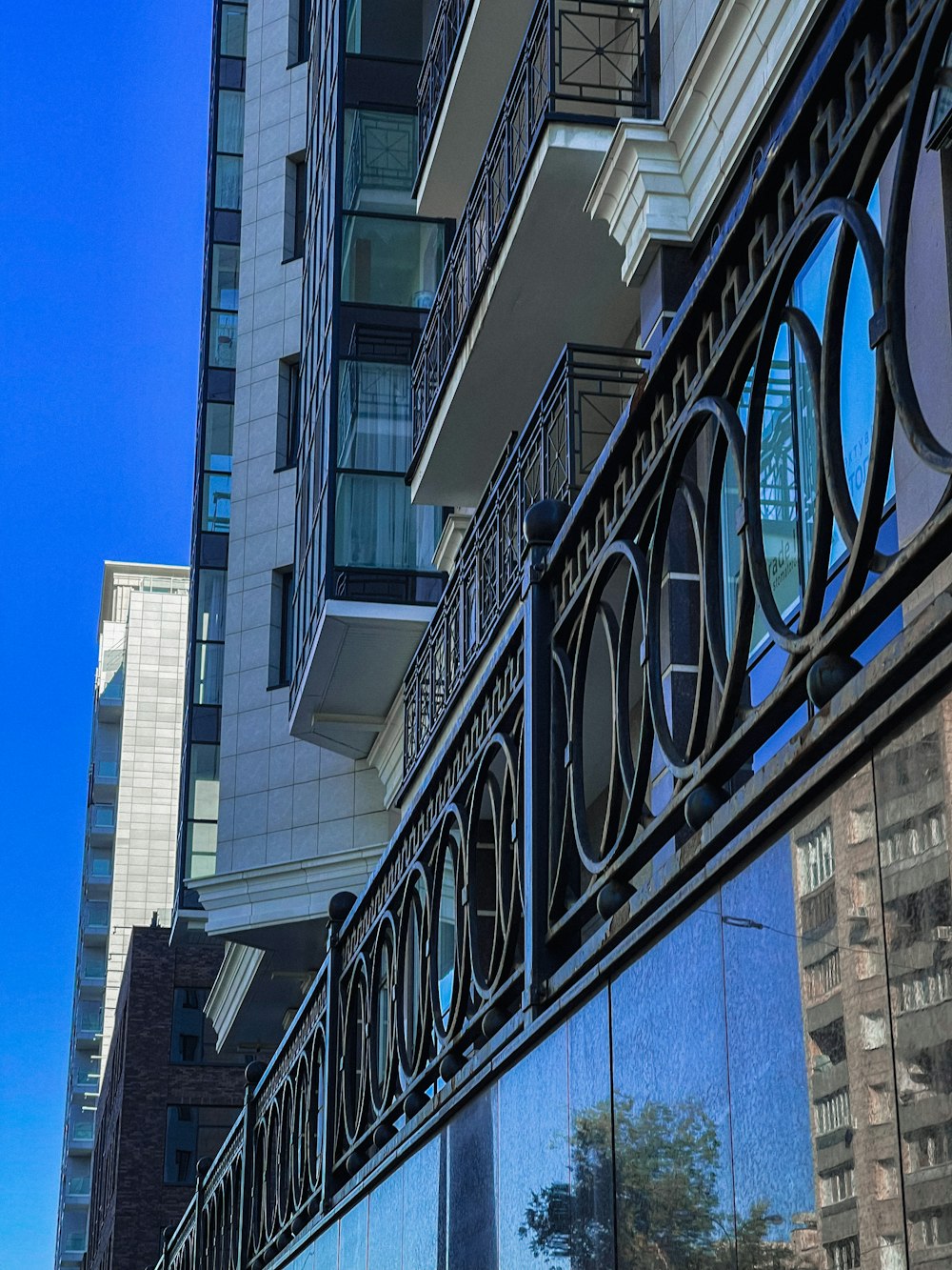 a reflection of a building in the glass of another building