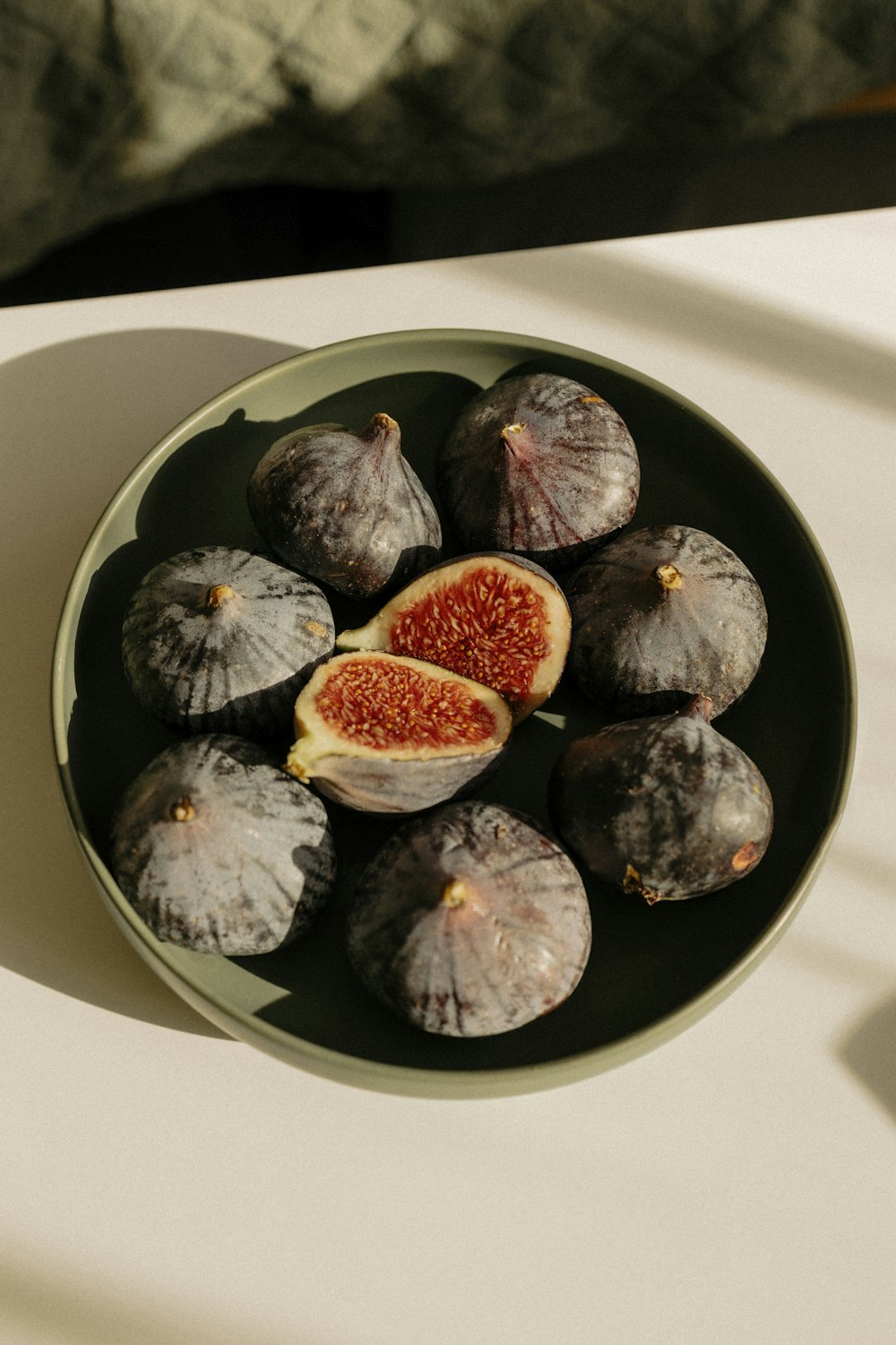 a plate of figs on a table