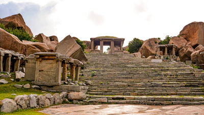 Weathered stone steps leading up to a mysterious ancient temple entrance.