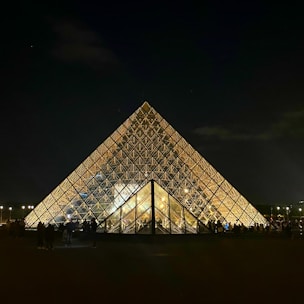 An event space showcasing a beautiful pyramid structure set up for a gathering.