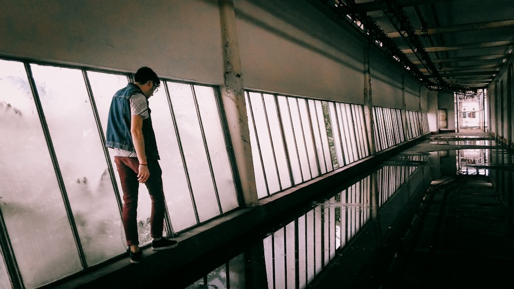 a man standing on the edge of a pool of water