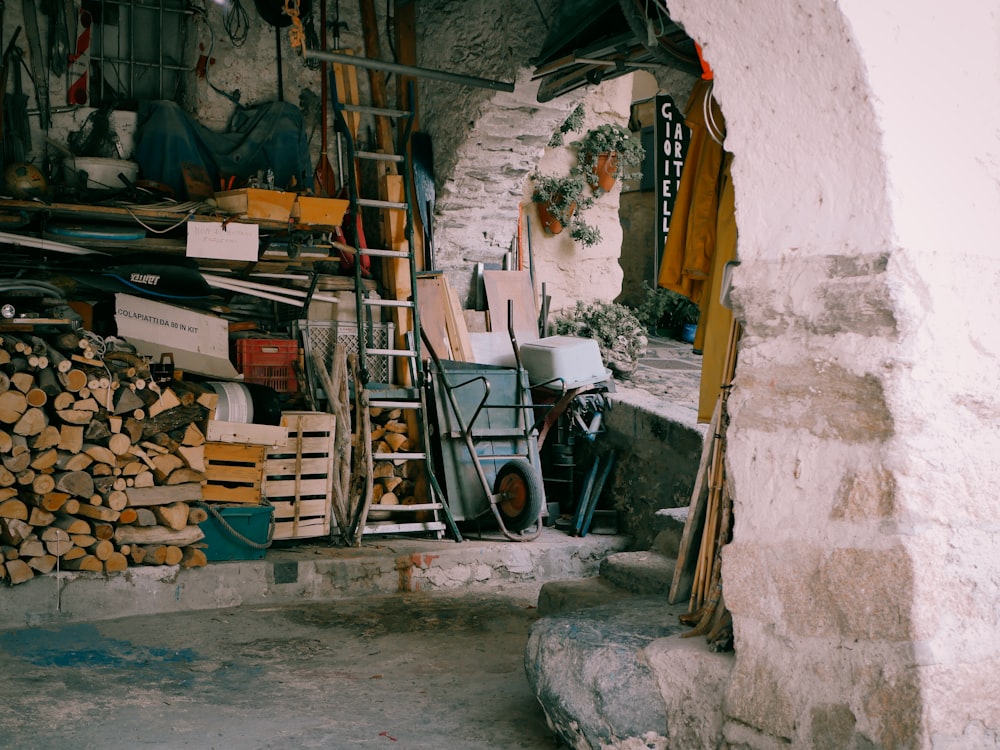 a pile of wood sitting next to a building