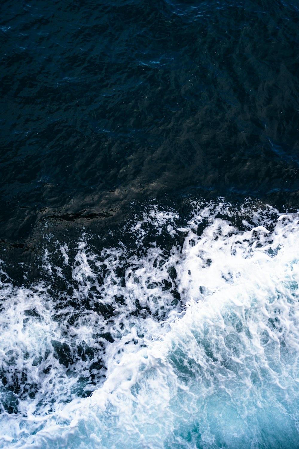 a large body of water surrounded by waves