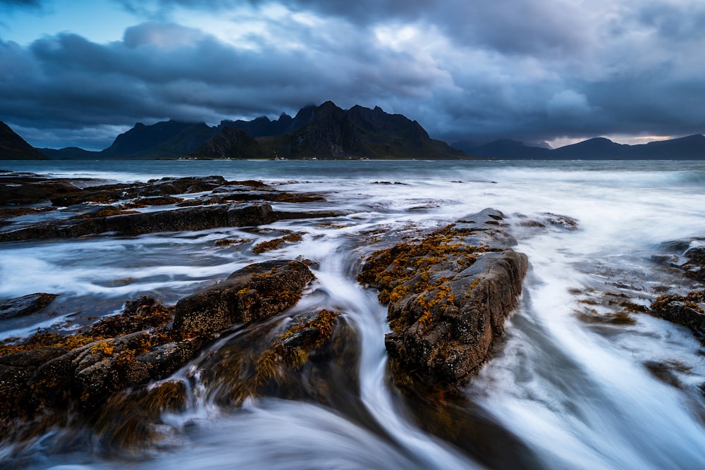 a large body of water surrounded by rocks