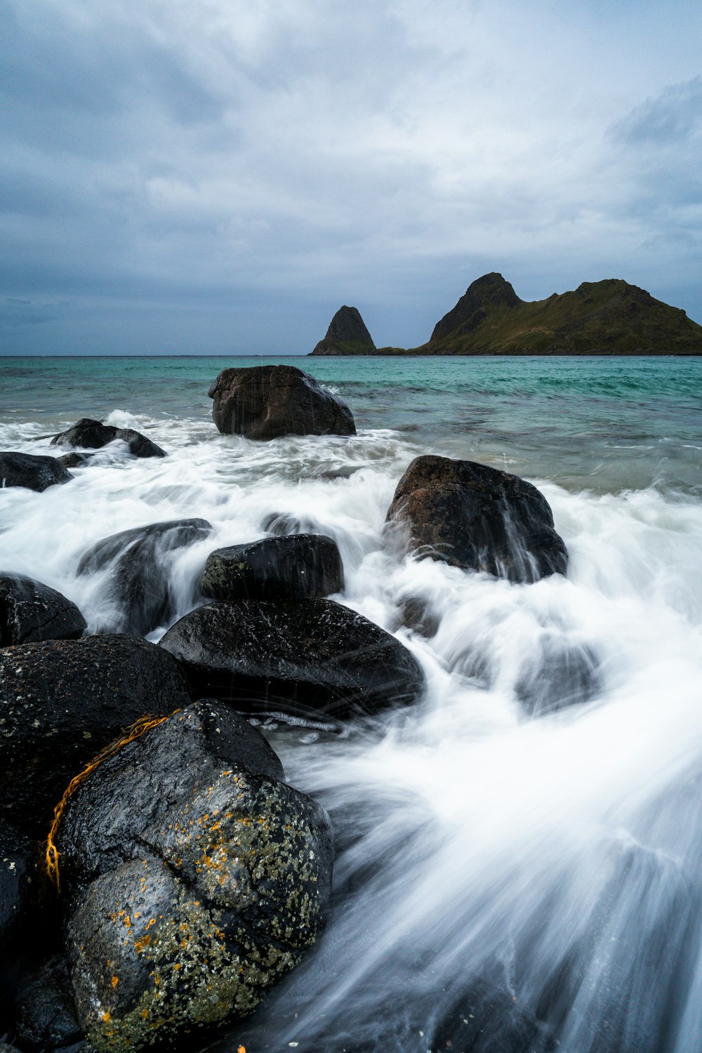 a large body of water surrounded by rocks