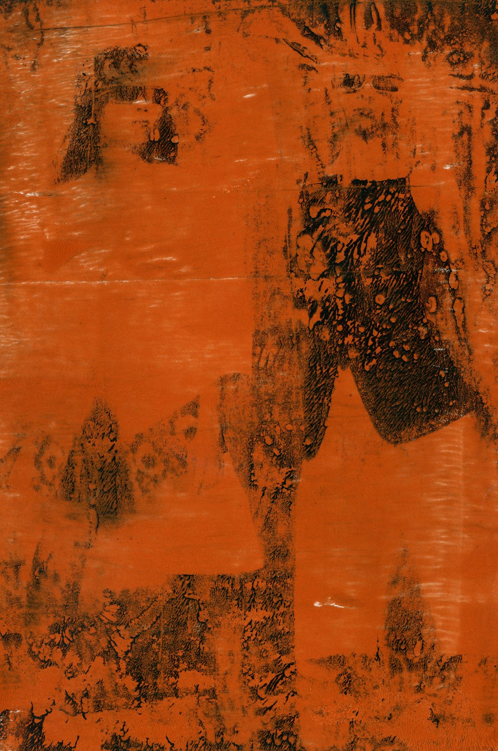 an orange and black painting on a wall