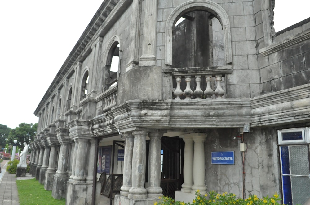 an old building with a clock on the front of it