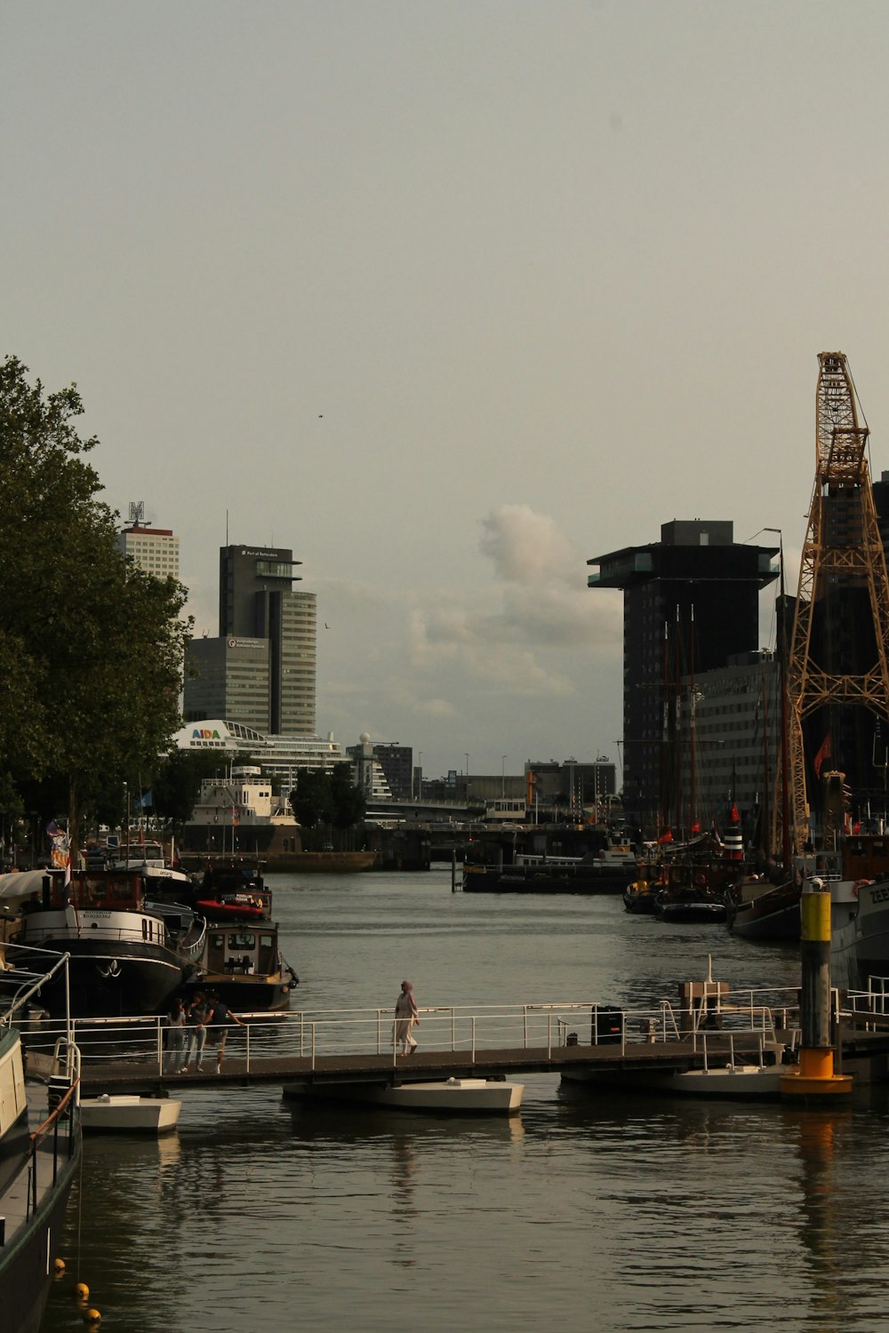 a body of water with boats and buildings in the background