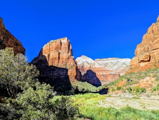 A vibrant landscape painting showcasing Utah's red rock formations.