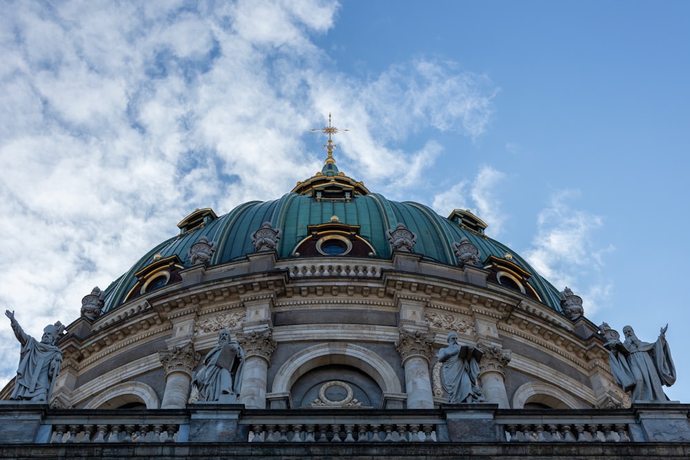 a building with a dome and a cross on top
