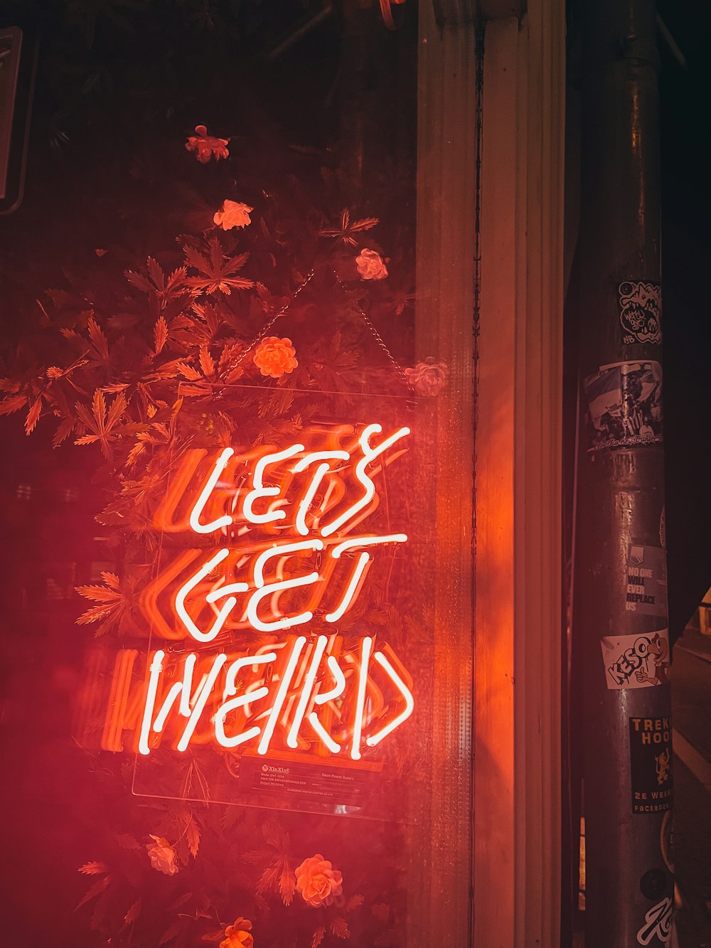 a neon sign that reads let's get weird