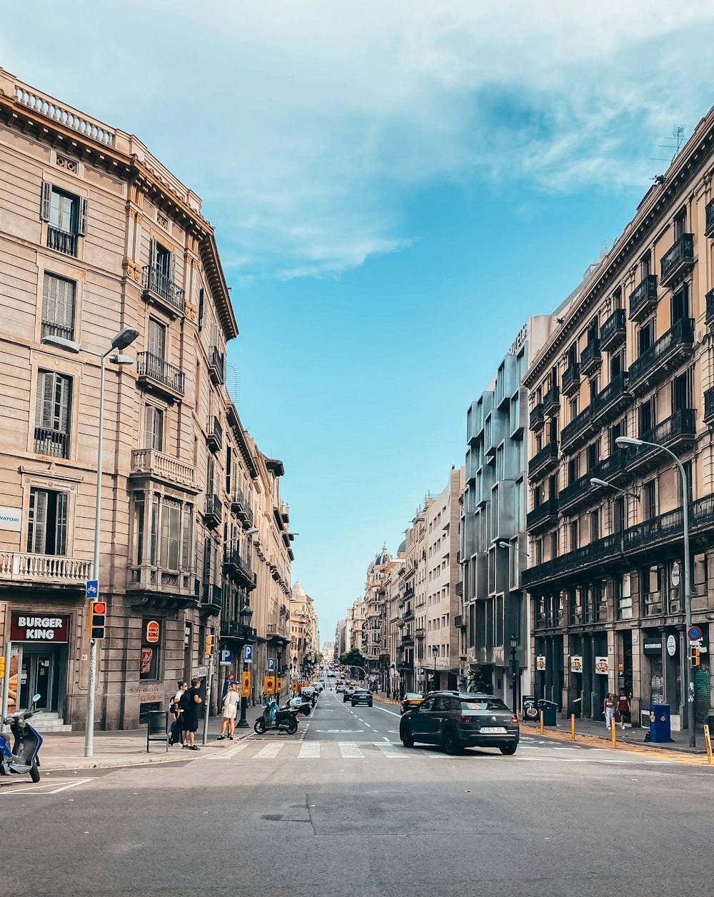 a city street filled with lots of tall buildings