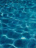 Before and after images of a cracked pool tile replaced flawlessly