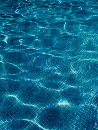 Technical visualization of waterproofing and piping systems integrated into a luxury pool design.