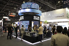 International trade fair with business professionals networking and exchanging ideas.