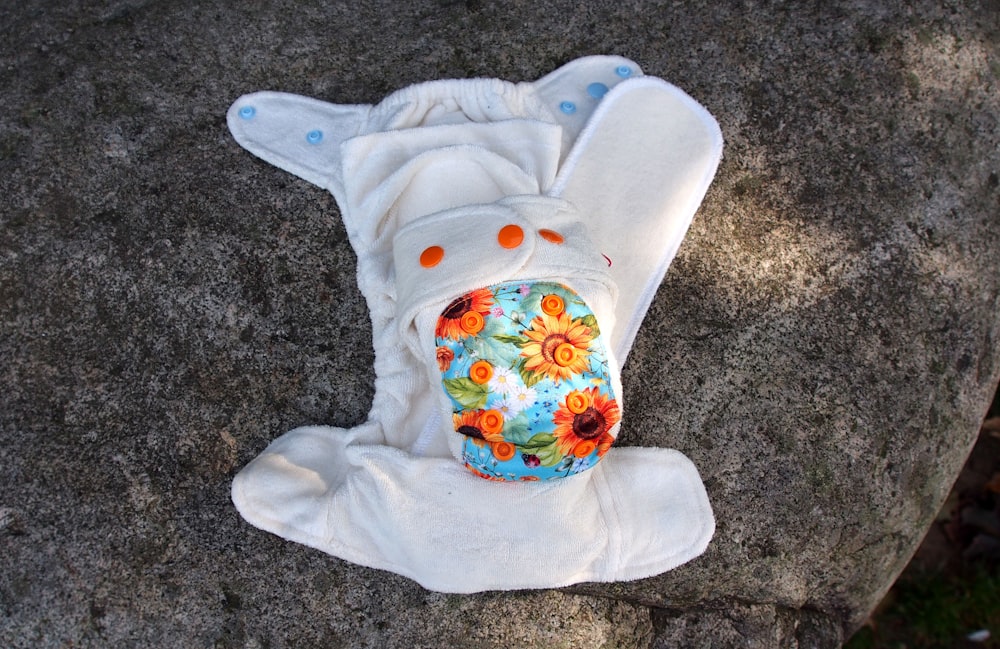 a cloth diaper sitting on top of a rock