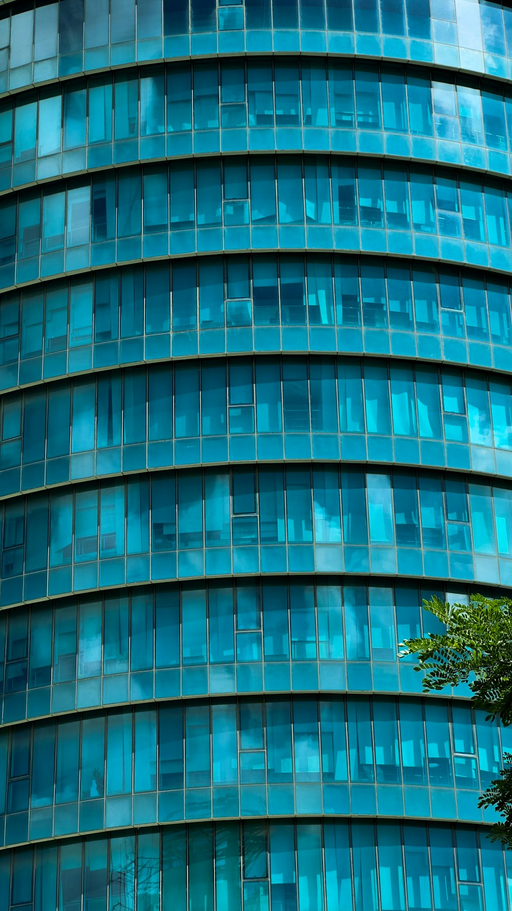 a very tall building with many windows and a clock