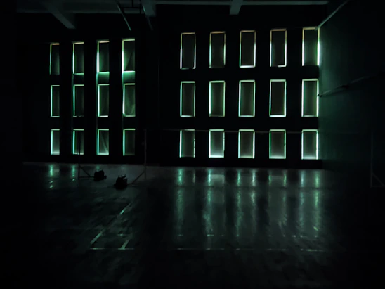 A sleek modern LED panel light softly illuminating a stylish, minimalist living room.