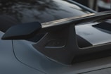 a close up of a car with a surfboard on the roof