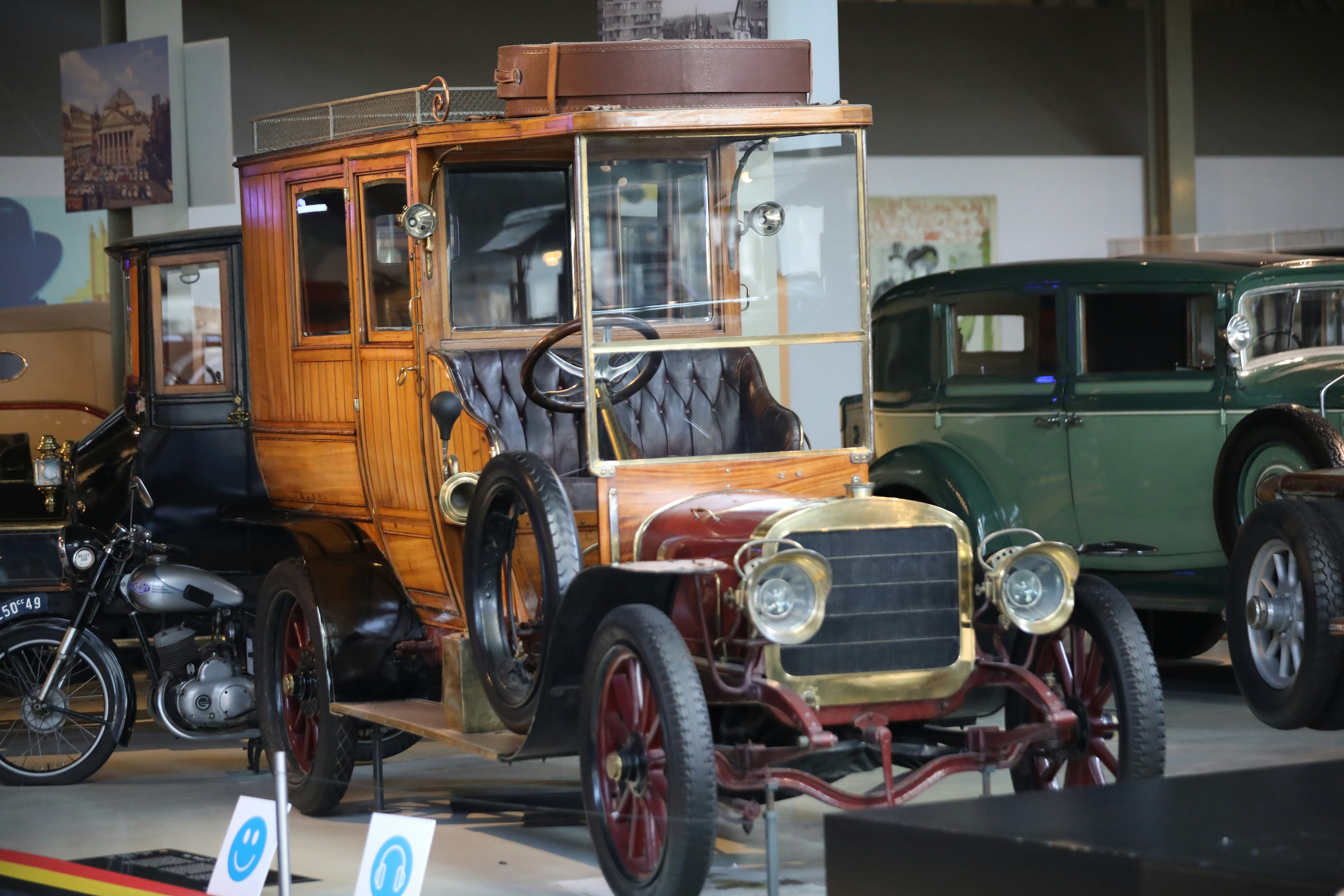 an antique car on display in a museum