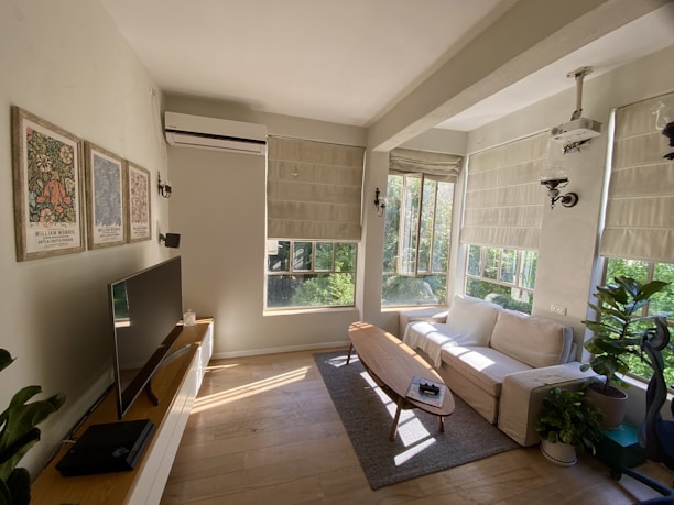 A bright, modern living room with tasteful decoration and natural light.