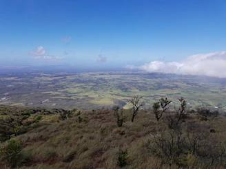 Aerial panorama of a sprawling ranch property with open fields.